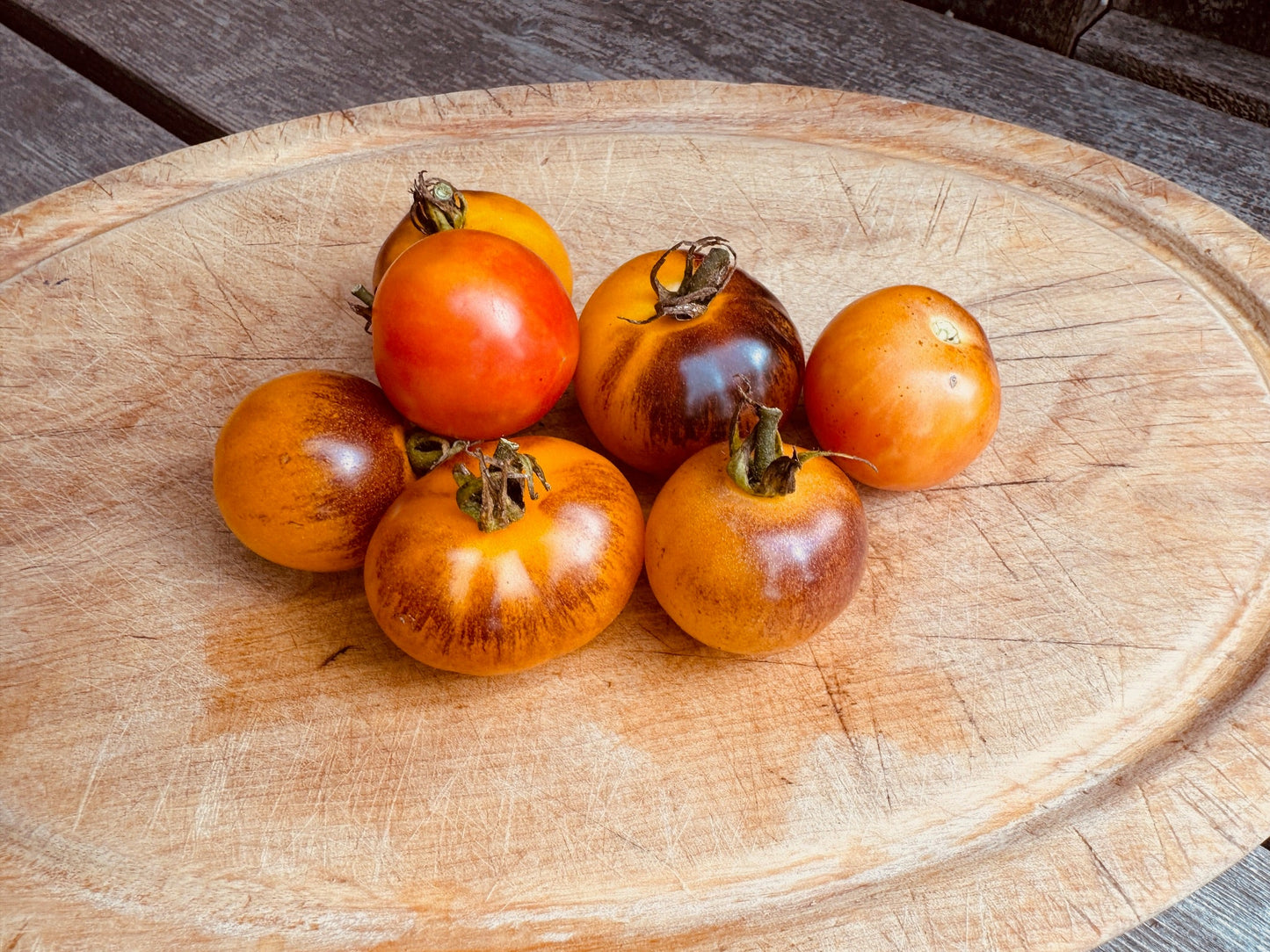 Tomatoes on a wooden cutting board