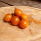 Tomatoes on a wooden cutting board